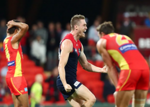 Tom McDonald kicks the point to win the game for the Melbourne Demons