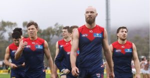 Max Gawn leads a dejected Melbourne side off Traeger Park after the Melbourne Demons loss to GWS by 2 points.